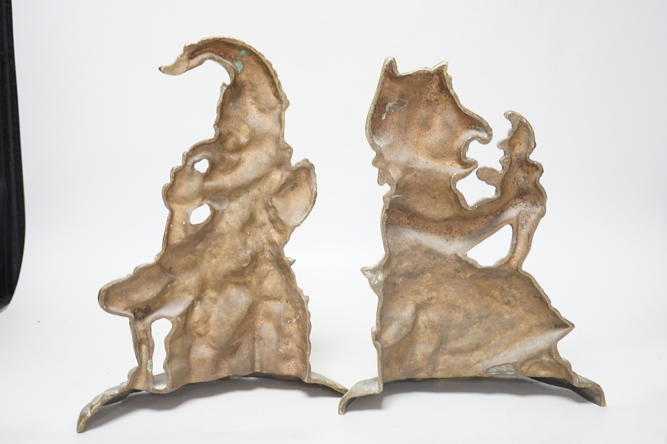 A pair of cast brass Punch and Judy door-stops, the largest 28cm high